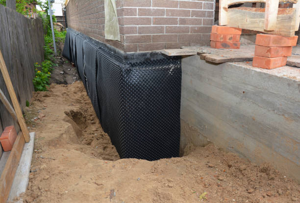 SJ Waterproofing Pros technician performing targeted Wet Basement Repair assessment in Stony Ridge, OH